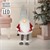 Figurka LED Secret Santa 80 cm czerwono-szara wykonana z tworzywa sztucznego i poliestru